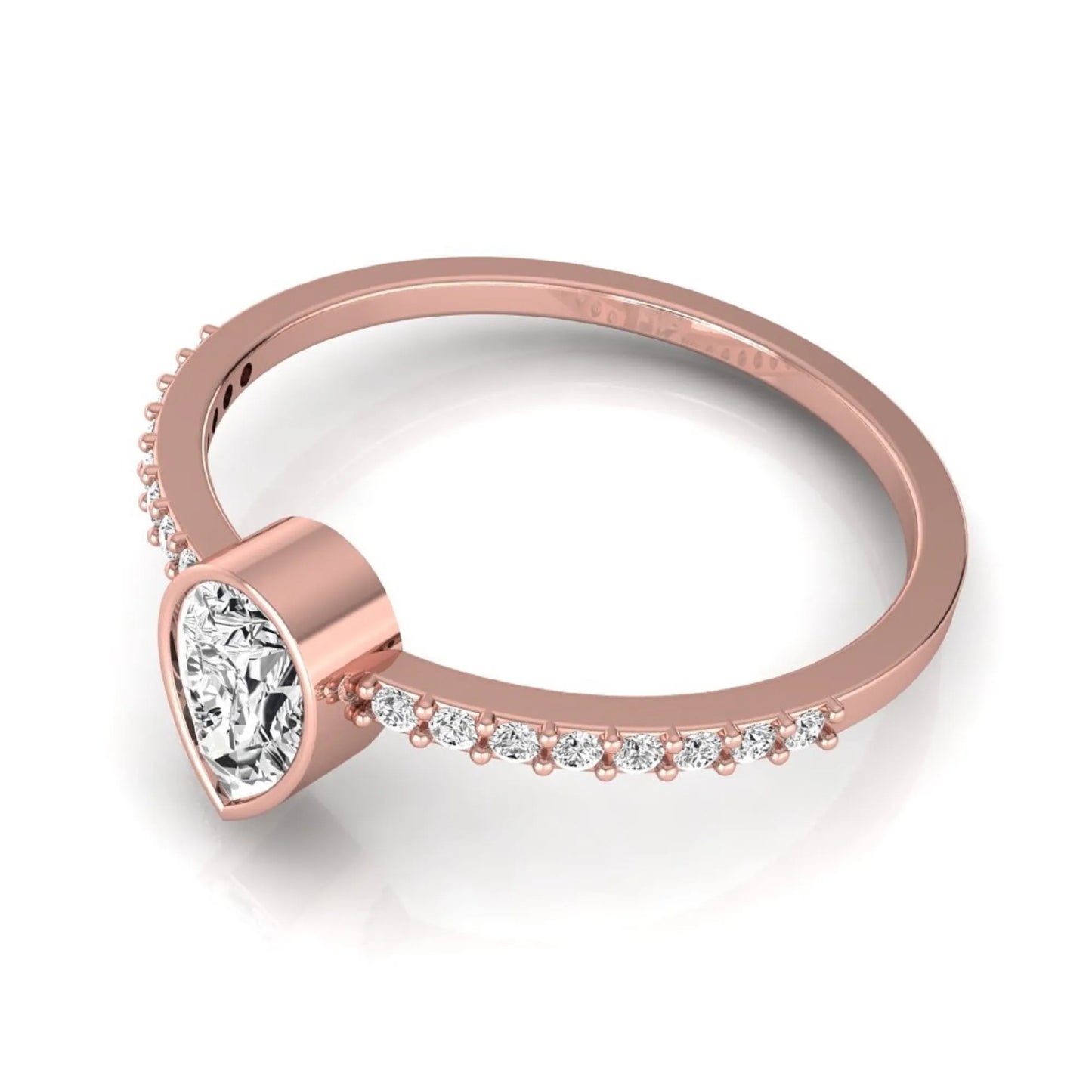 Rose-gold ring with heart-shaped diamond and smaller diamonds on a white background