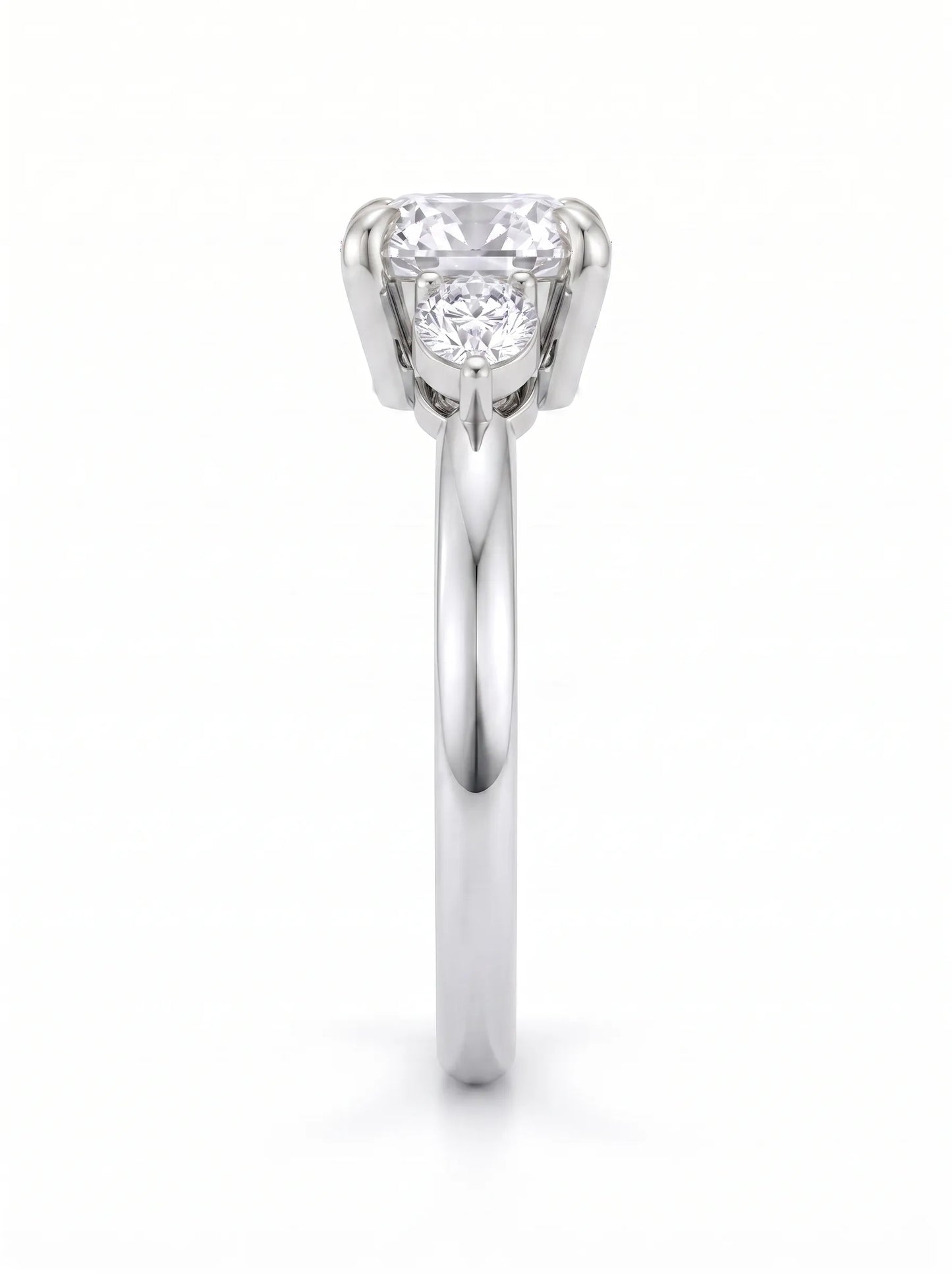 Cushion cut lab grown diamond three stone engagement ring with pear cut side diamonds in a classic prong setting in white gold