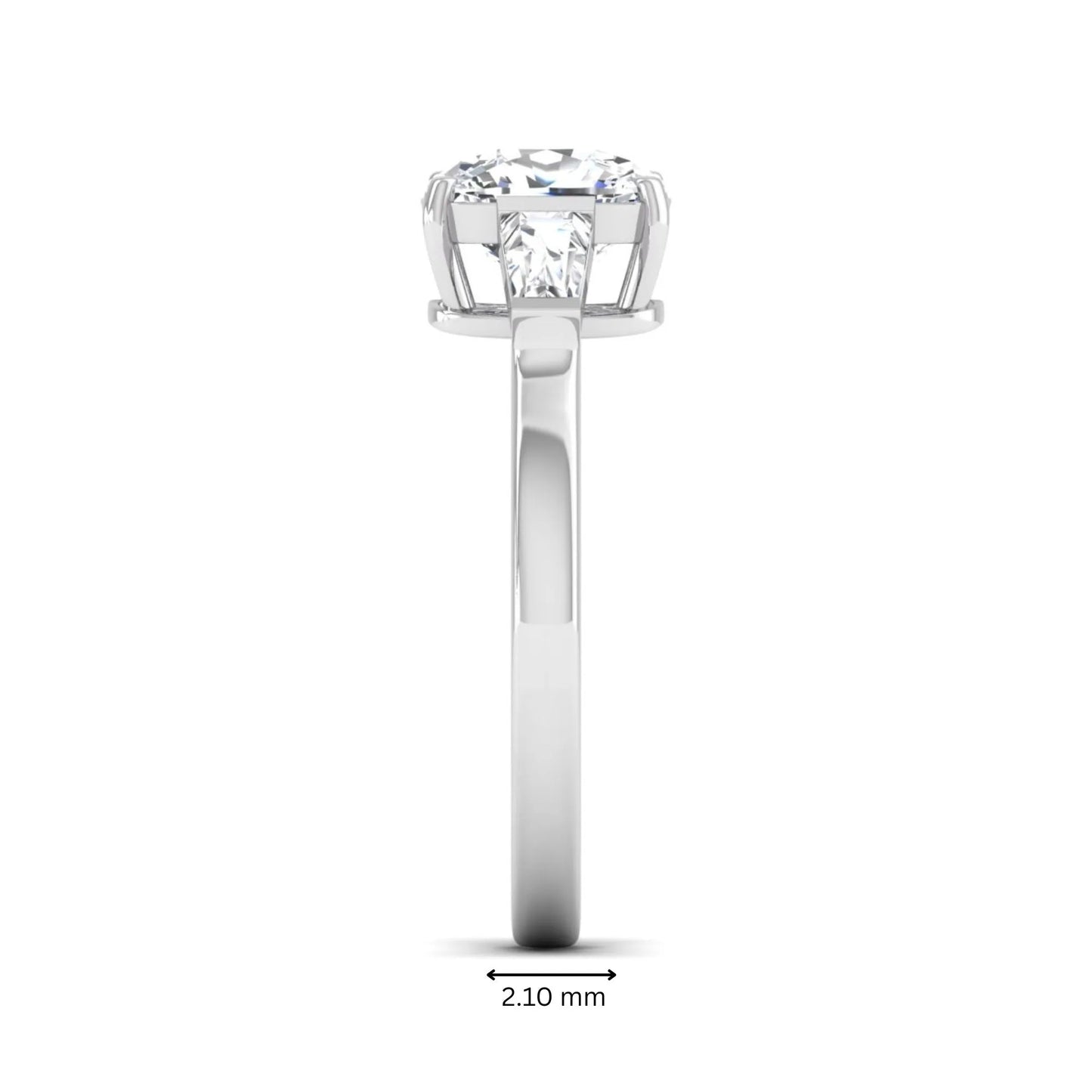Cushion cut lab grown diamond three stone engagement ring with baguette side diamonds in a four prong setting and white gold tone band.