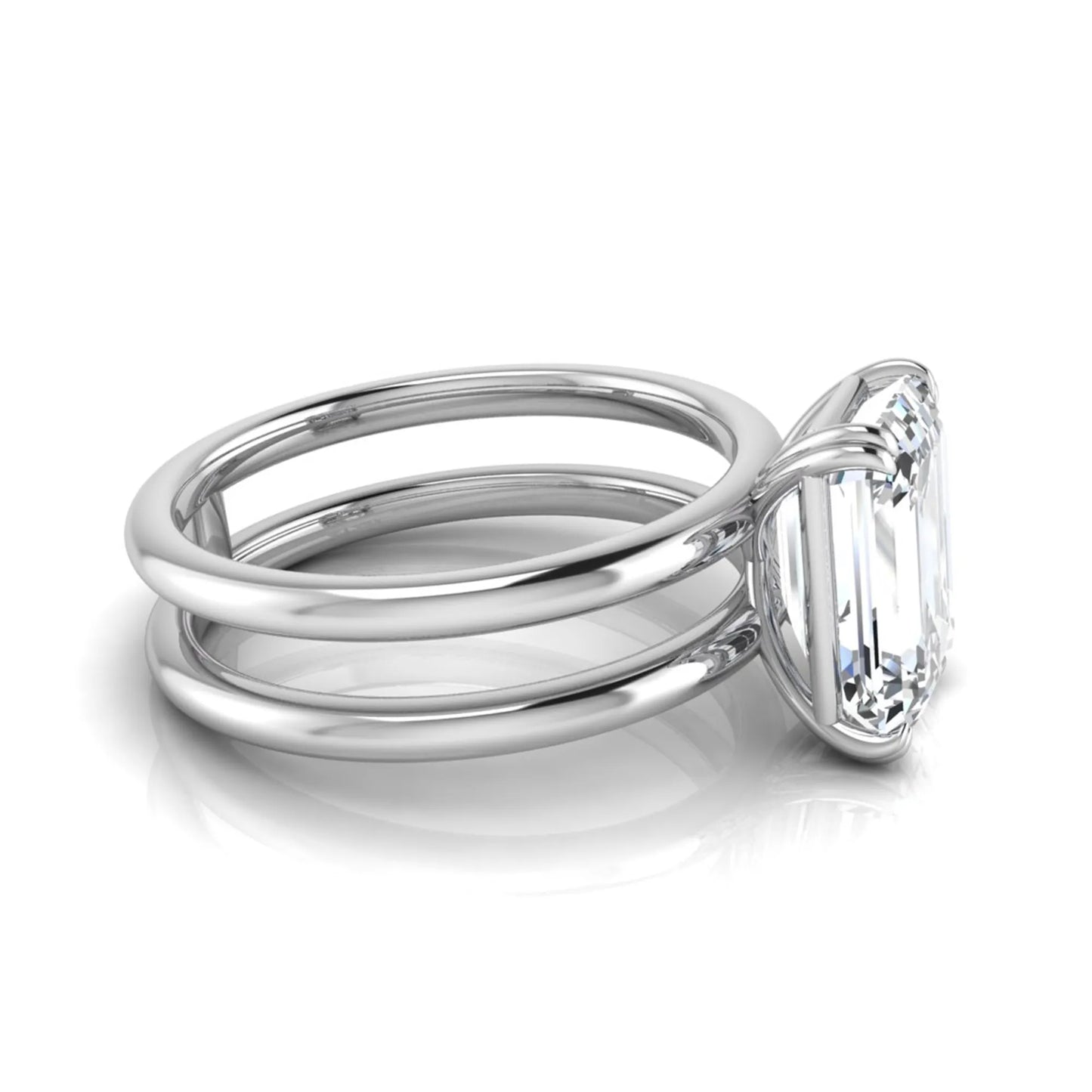 Emerald cut lab grown diamond double band engagement ring featuring a 3.01 carat IGI certified solitaire diamond in a four-prong setting in white gold