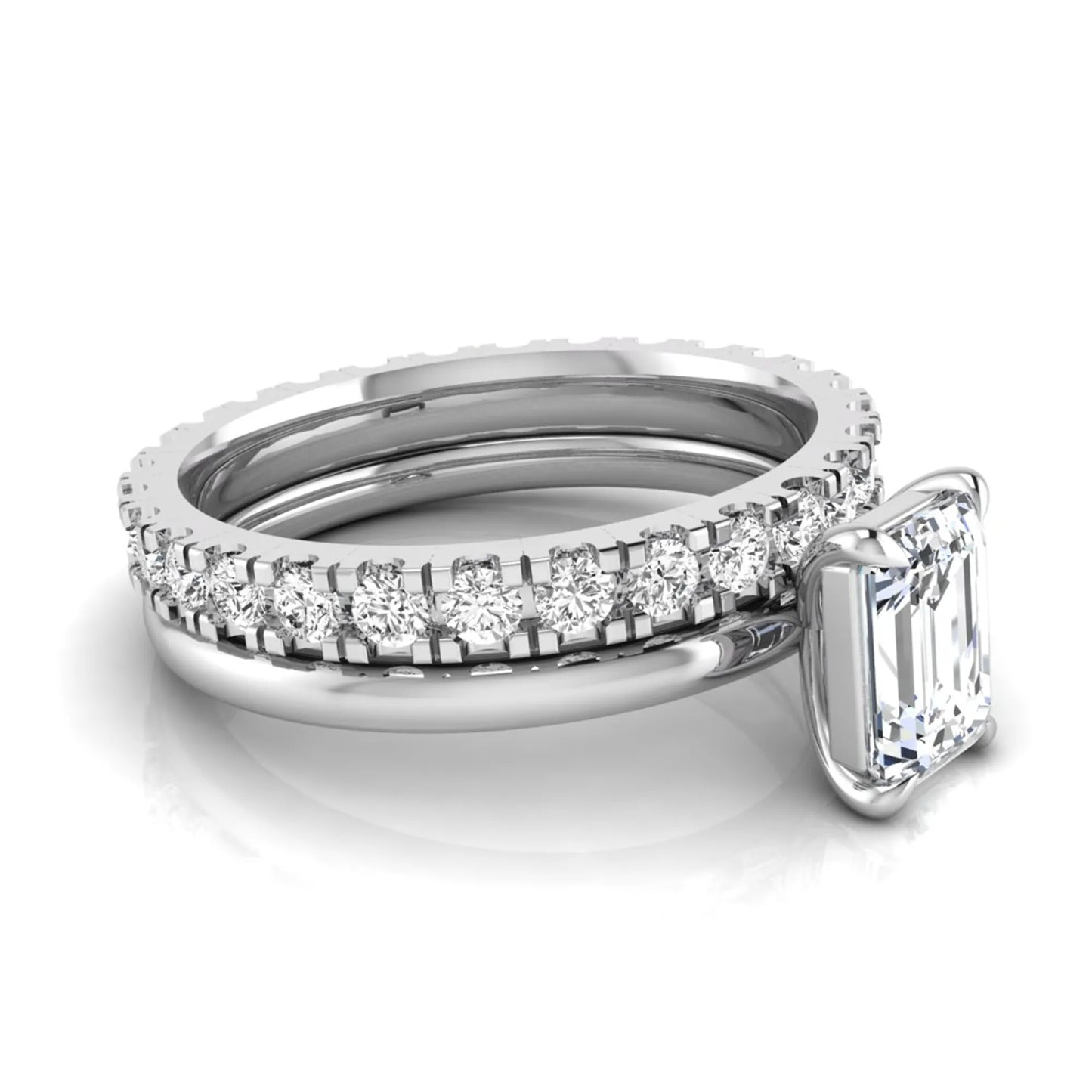 Emerald cut lab grown diamond bridal ring set featuring a 1.06 carat IGI certified center diamond with a matching round diamond wedding band in white gold.