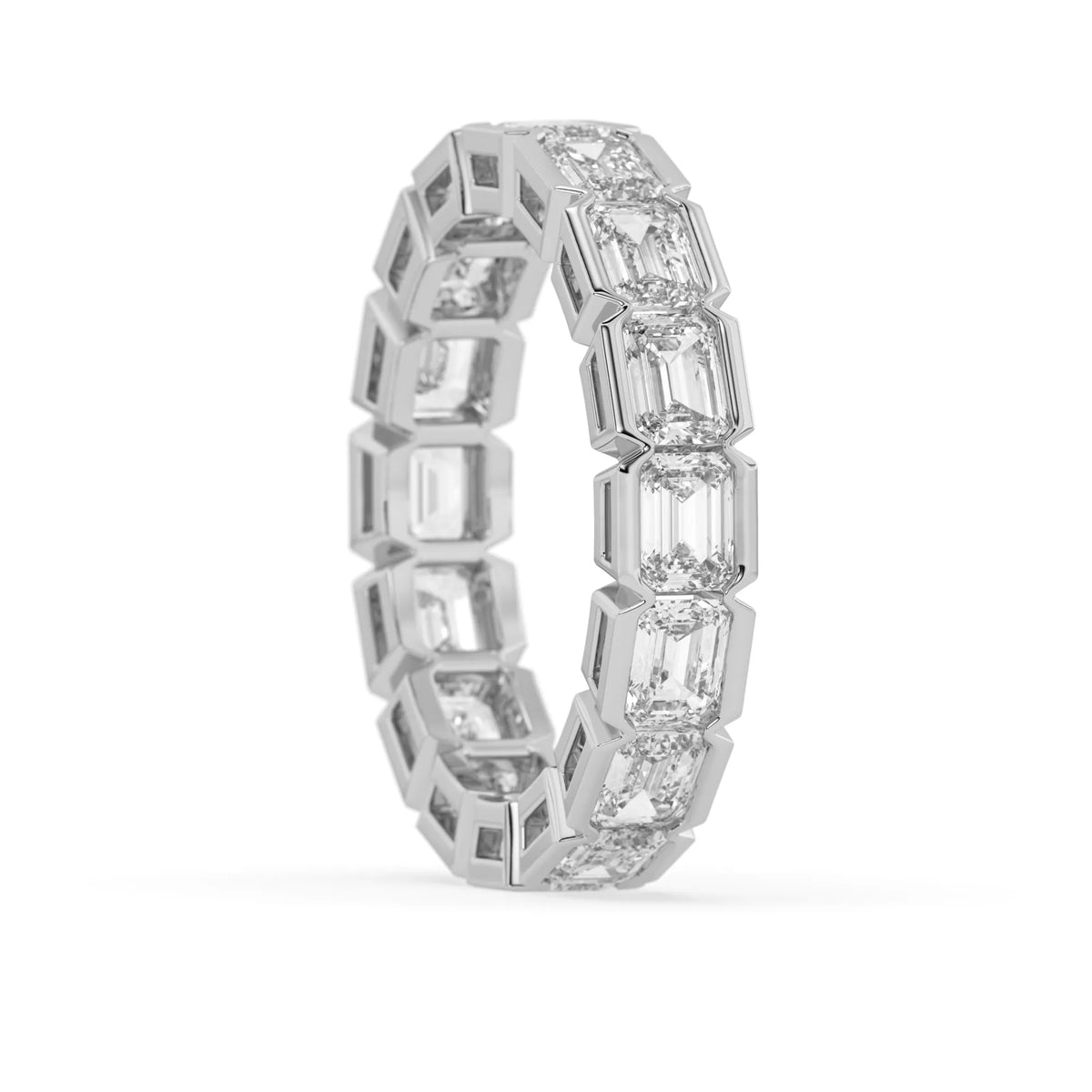 Emerald cut lab grown diamond eternity ring featuring a continuous row of step-cut diamonds in a modern full bezel setting in white gold