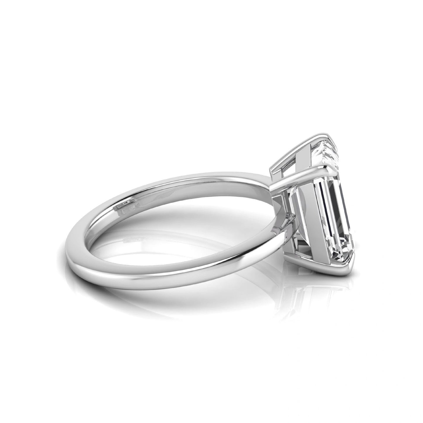 Emerald cut lab grown diamond solitaire engagement ring with a four prong setting in a white gold tone, featuring an IGI certified 3.01 carat center diamond.