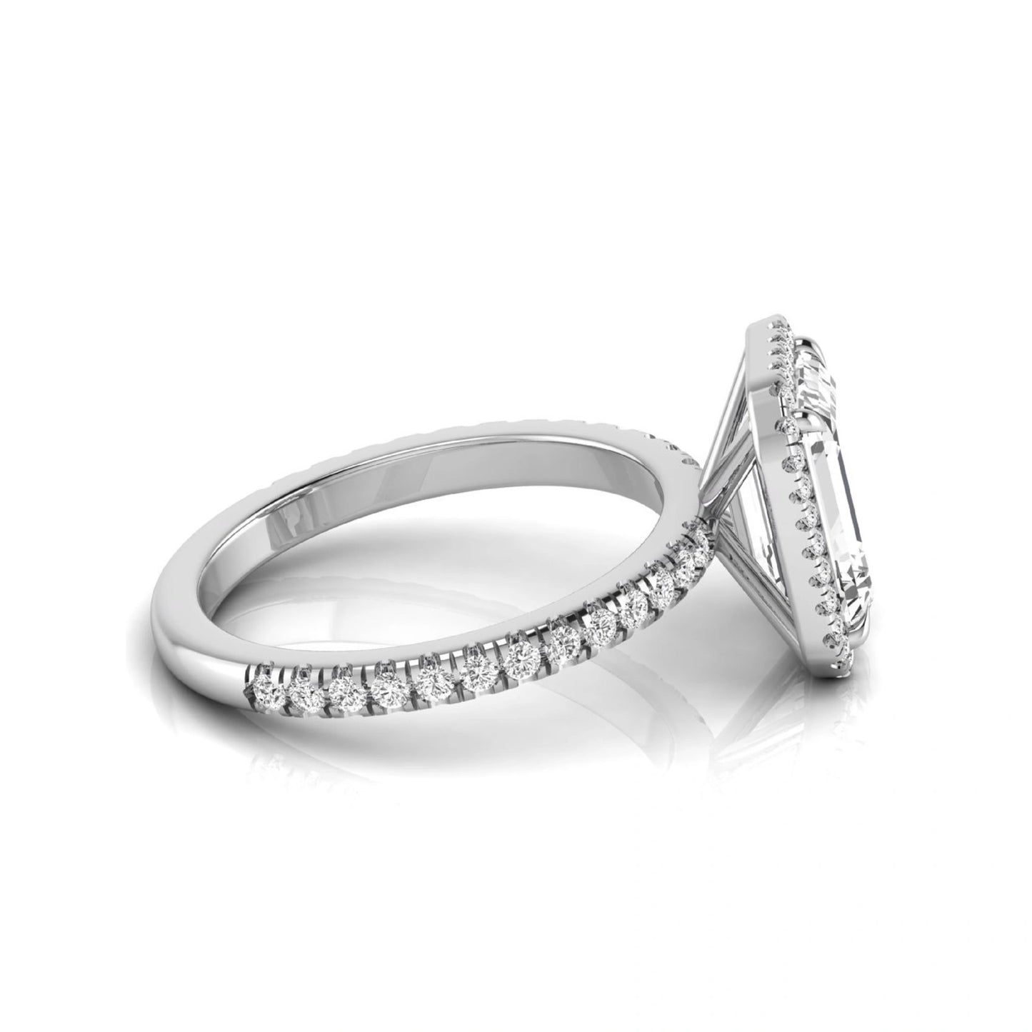 Emerald cut lab grown diamond engagement ring featuring a round diamond halo, pavé accent band, and four-prong setting with a polished white gold tone band.