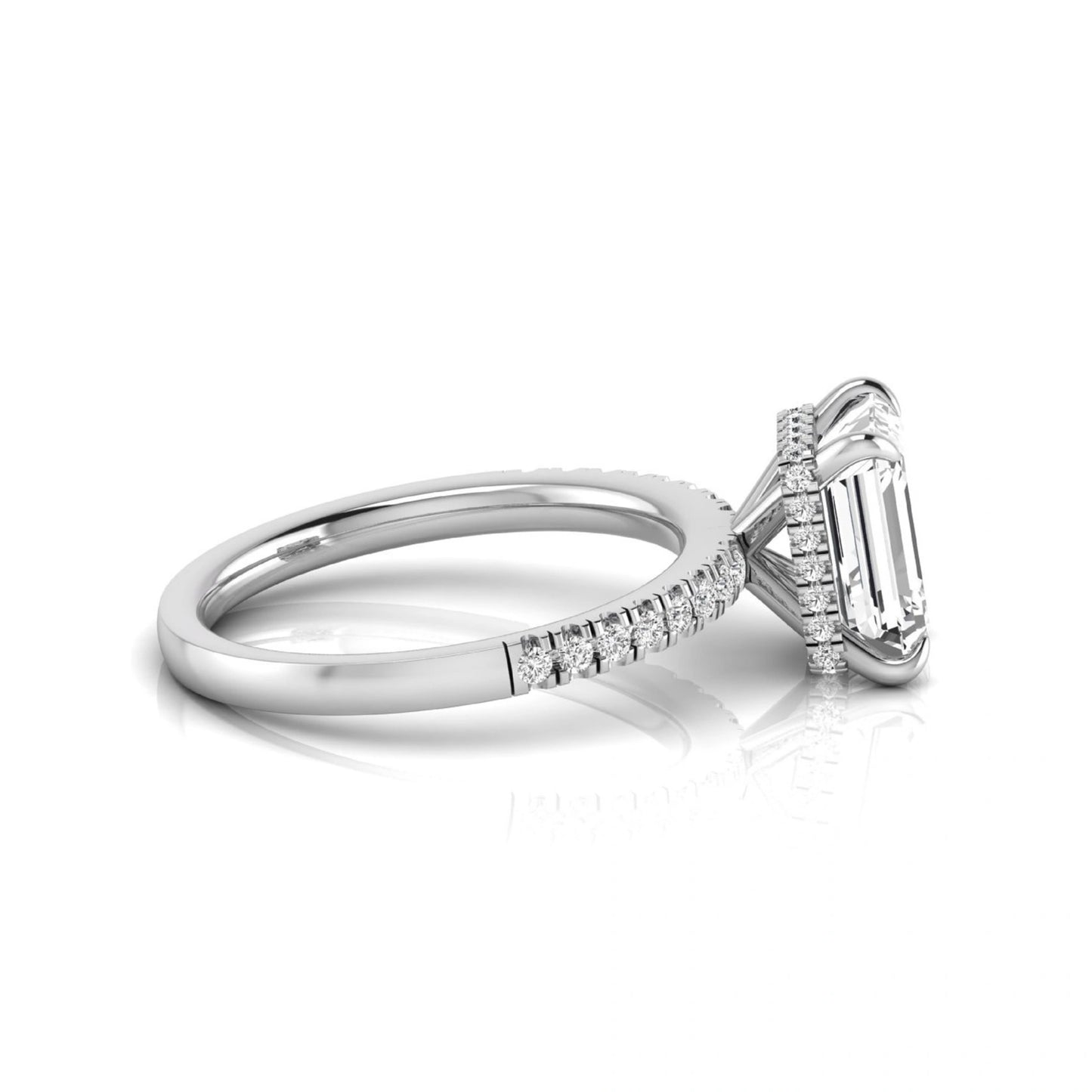 Emerald cut lab grown diamond engagement ring featuring a hidden halo, pavé diamond band, and four-prong setting in white gold tone.
