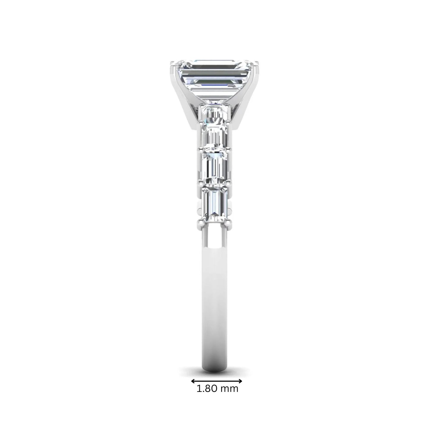 Emerald cut lab grown diamond engagement ring with baguette side diamonds in a four-prong solitaire accent setting and white gold tone band.