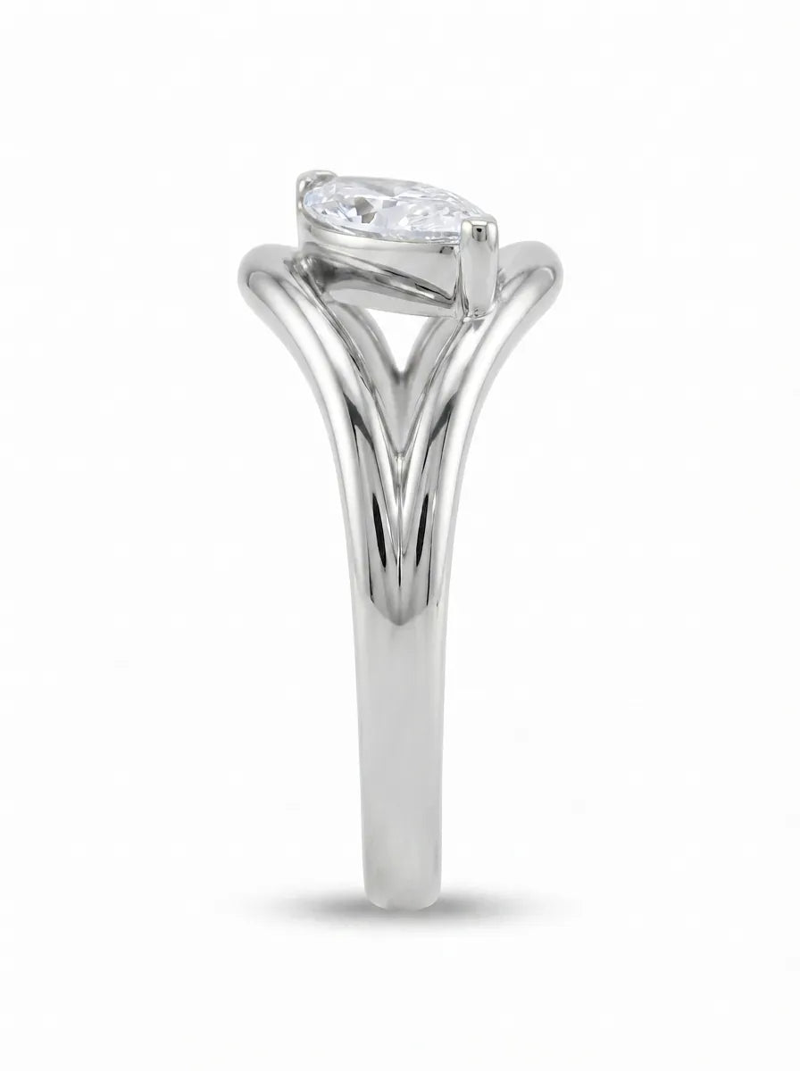 Marquise cut lab grown diamond open frame solitaire engagement ring in a white gold sculptural setting