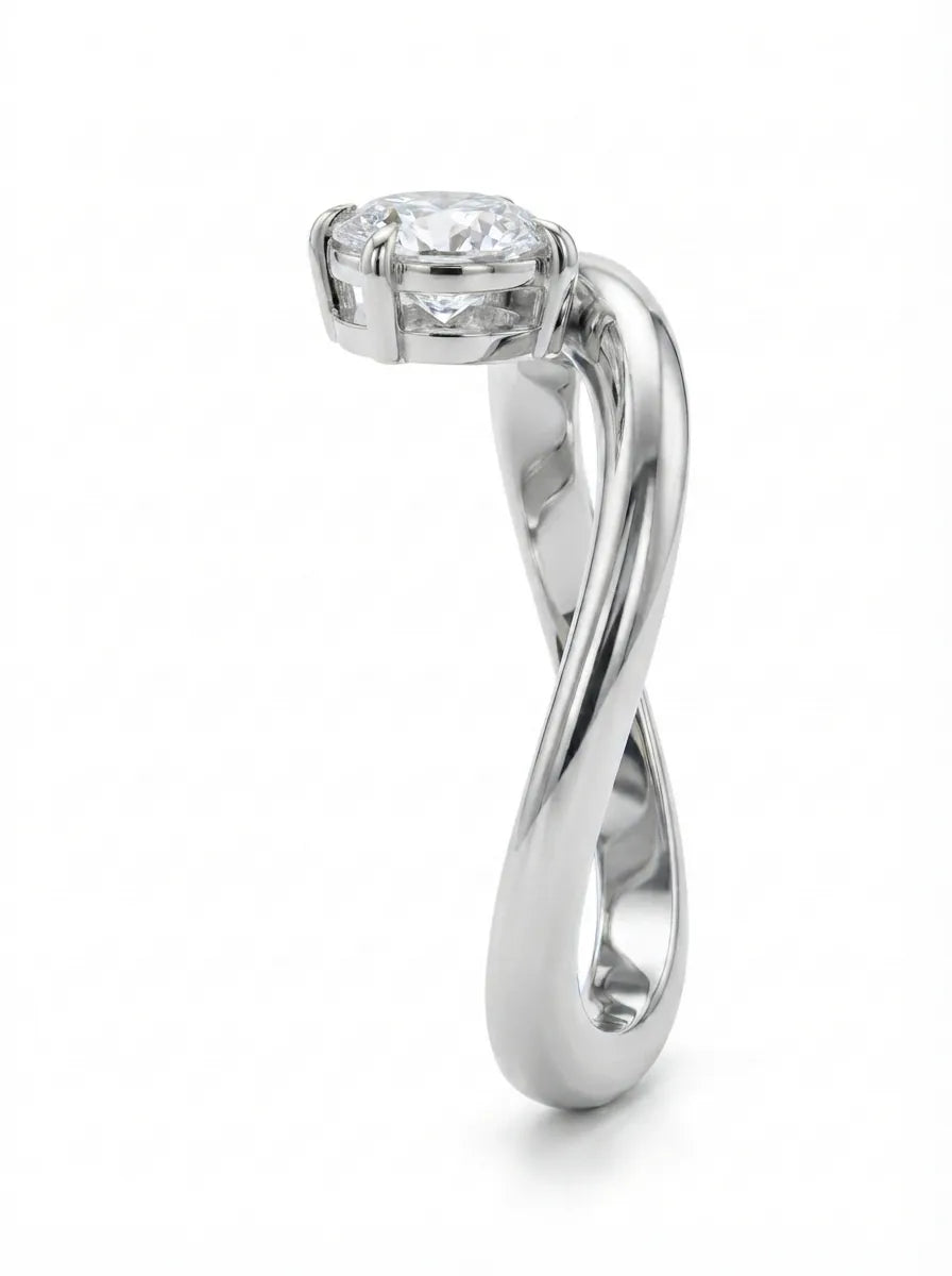 Oval cut lab grown diamond curved solitaire engagement ring with a four-prong setting in white gold