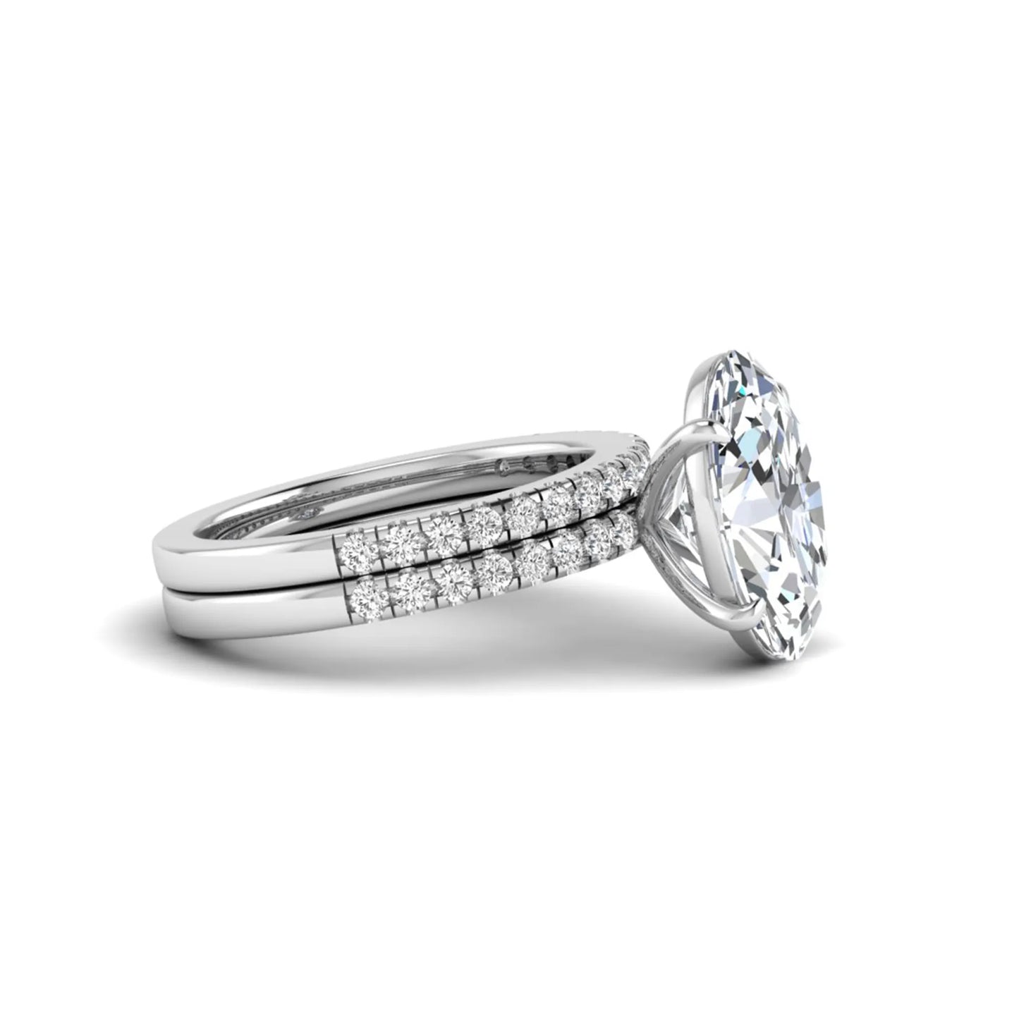 Oval Cut Pavé Solitaire Lab Grown Diamond Engagement Ring Set featuring a 3.92 carat IGI Certified oval diamond with a matching pavé diamond wedding band in white gold.