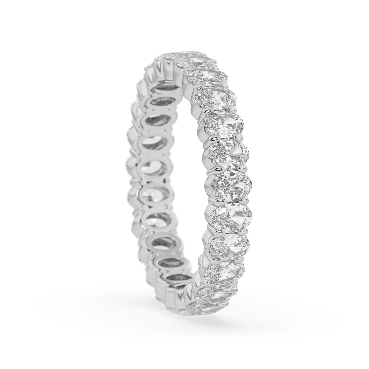 Oval cut lab grown diamond eternity band featuring a continuous row of brilliant shared-prong set diamonds in a timeless luxury design in white gold