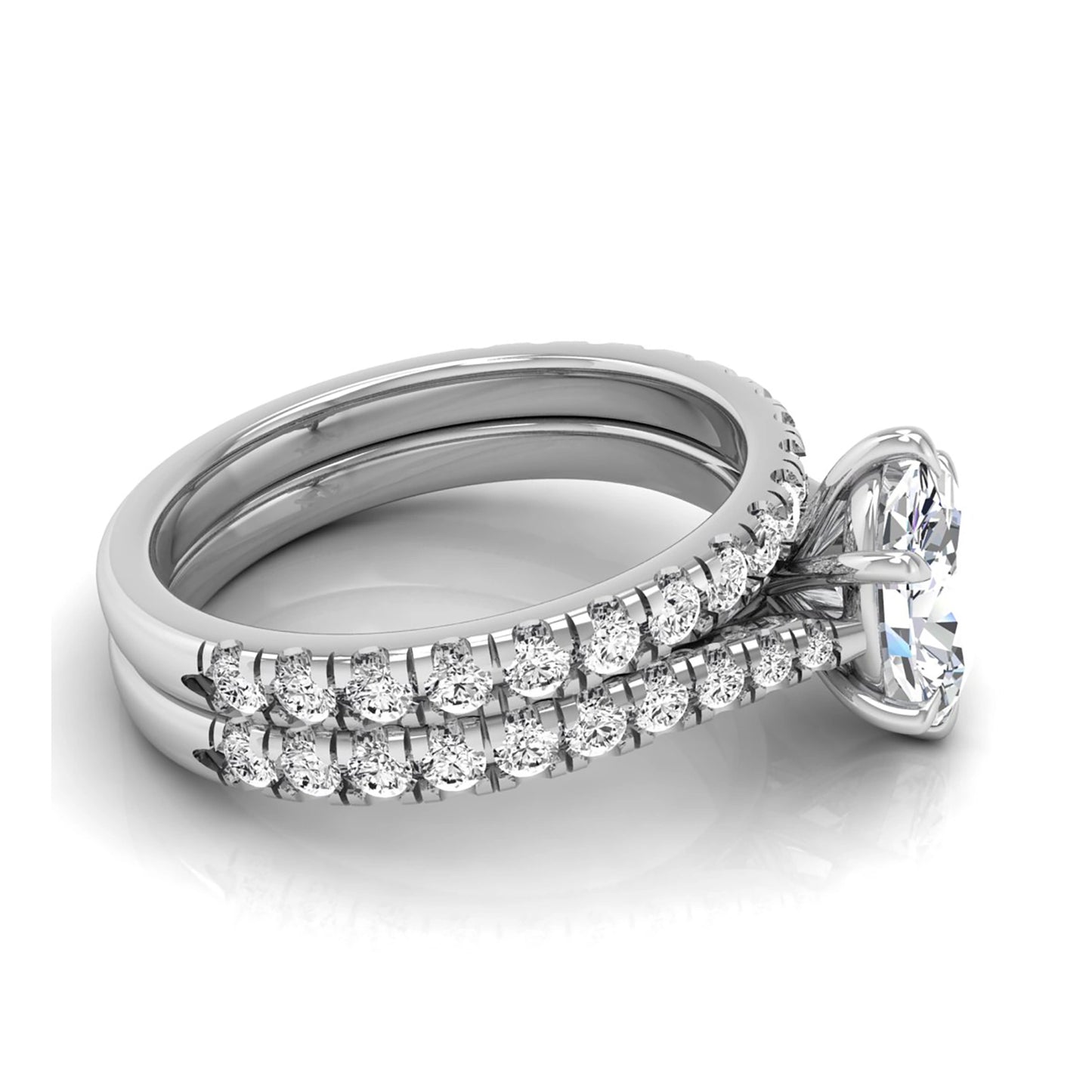 Oval cut lab grown diamond bridal ring set with pavé engagement ring and matching diamond wedding band in white gold style.