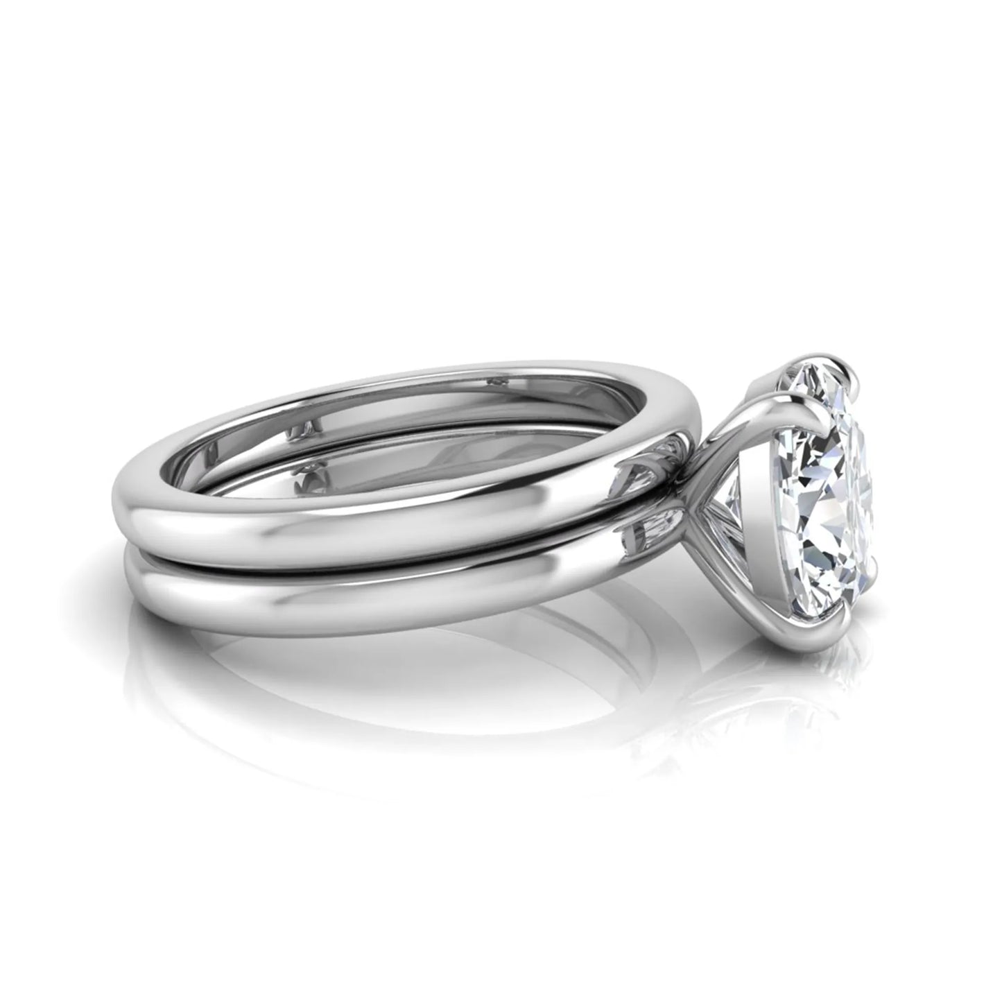 Oval cut lab grown diamond solitaire engagement ring with a matching plain gold wedding band in white gold