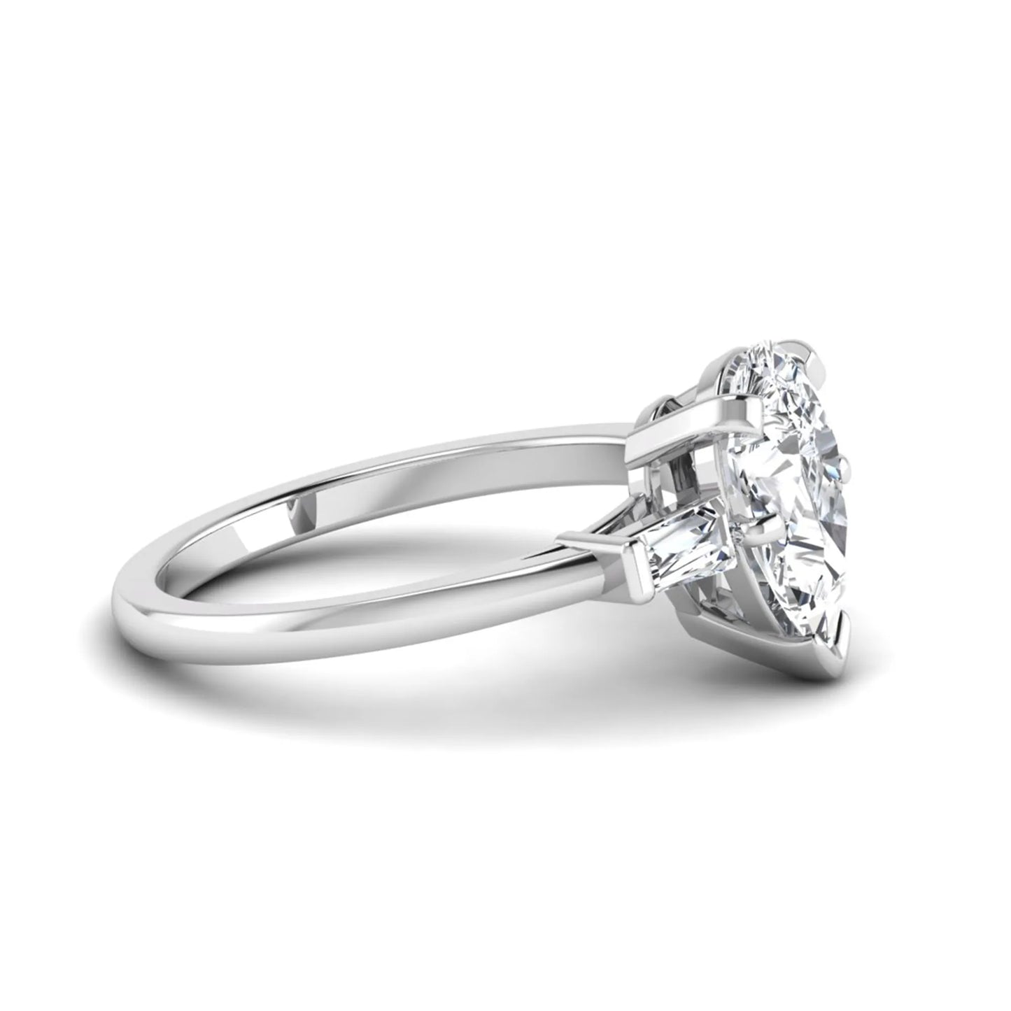 Pear cut lab grown diamond three stone engagement ring featuring a 2.31 carat IGI certified center diamond with tapered baguette side diamonds in white gold.