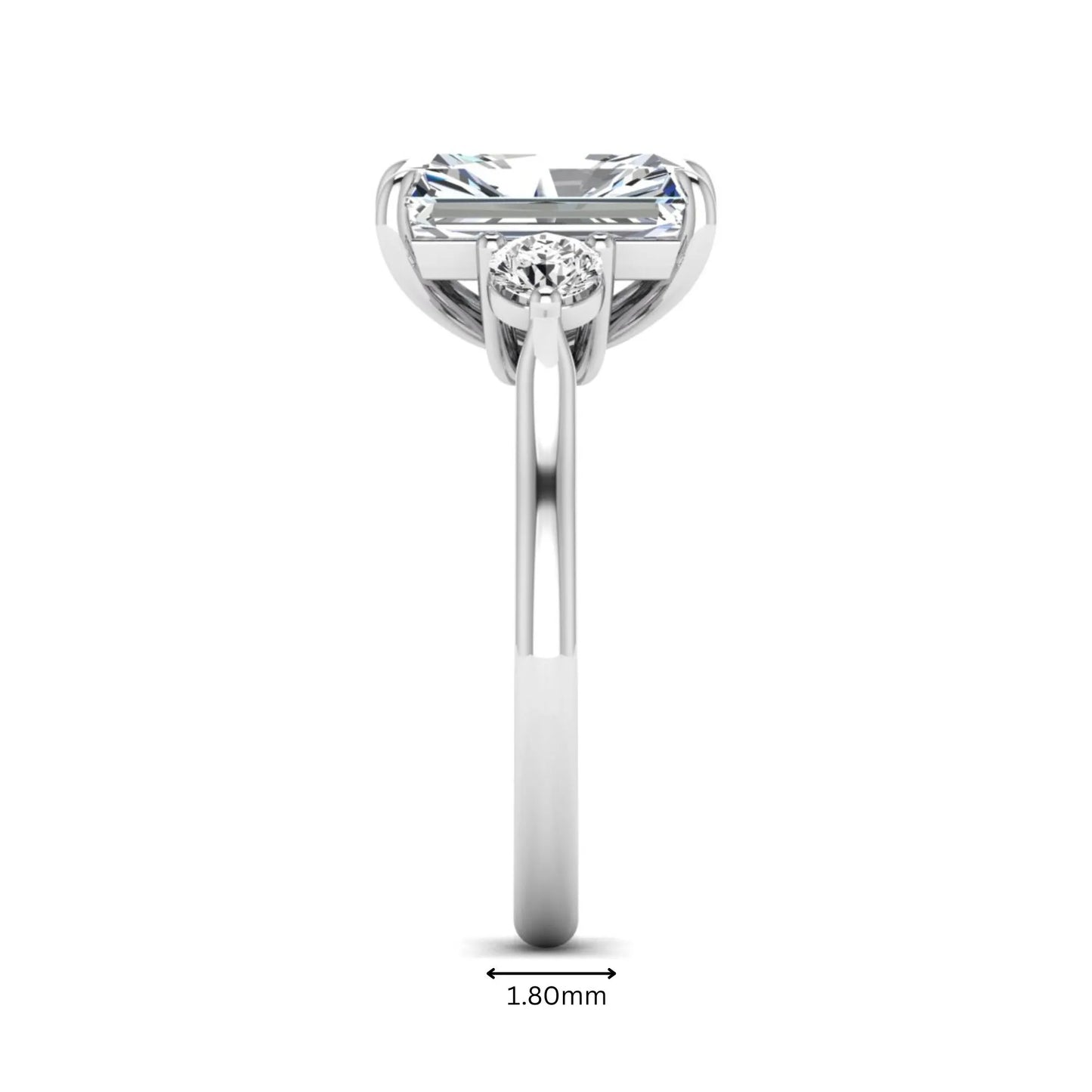 Radiant cut lab grown diamond three stone engagement ring with round side diamonds in a four-prong setting and white gold tone band.