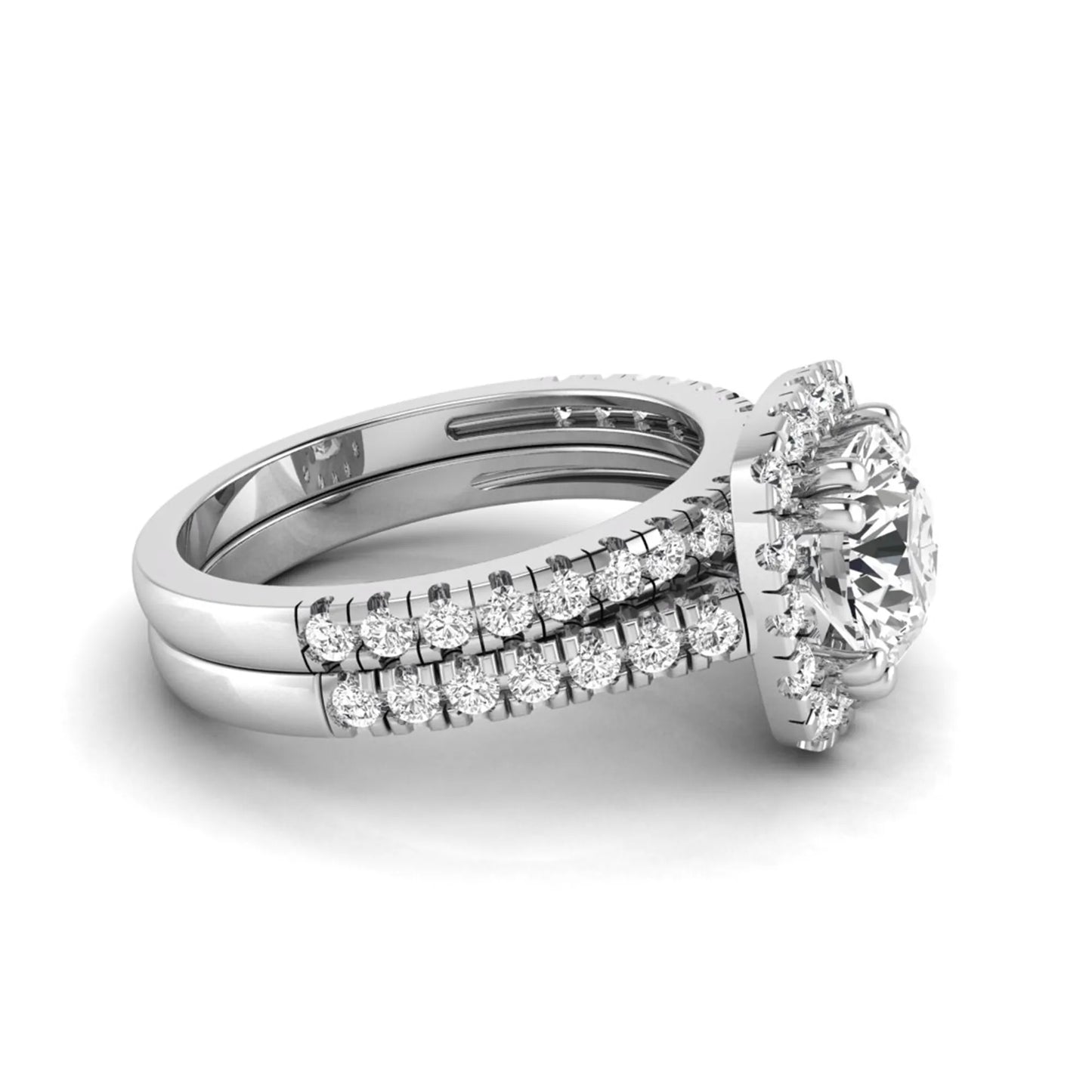 Round cut lab grown diamond halo bridal ring set featuring a split pavé engagement ring with matching diamond wedding band in white gold finish.