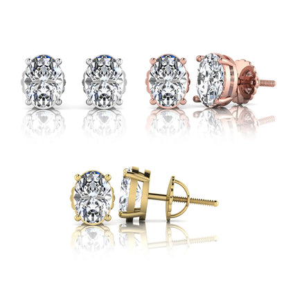 Set of diamond stud earrings in gold and rose gold on a white background
