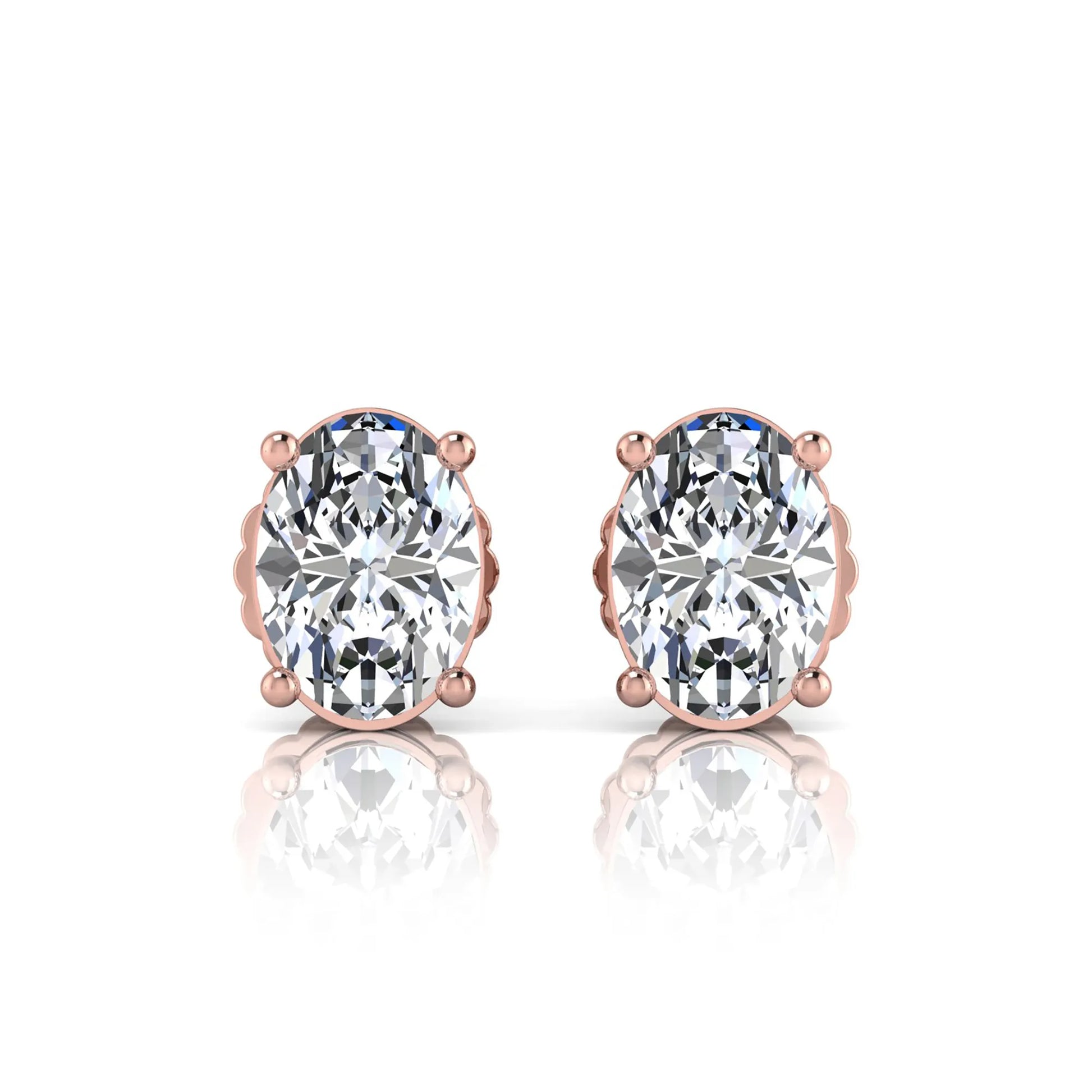 Rose gold earrings with large clear lab grown diamonds on a white background