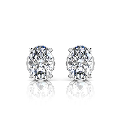 white gold Pair of stud earrings with clear lab grown diamond on a white background