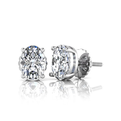 white gold Pair of diamond stud earrings on a white background
