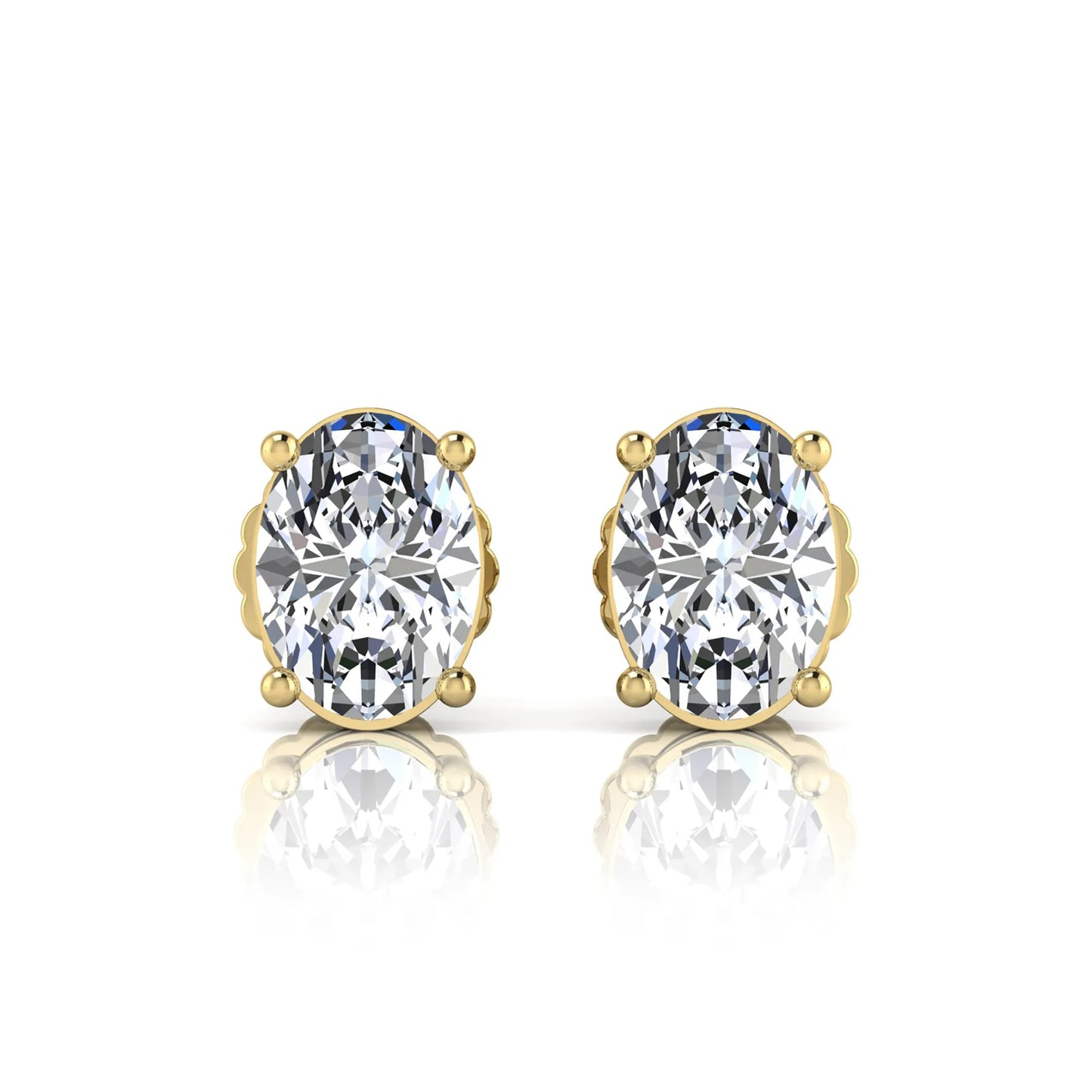 yellow Gold earrings with large clear gemstones on a white background
