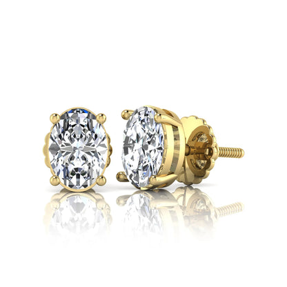 yellow Gold stud earrings with clear gemstones on a white background