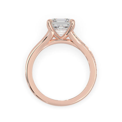 Rose gold ring with a diamond on a white background
