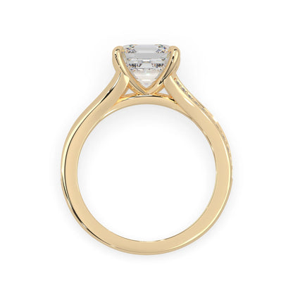 yellow Gold ring with a diamond on a white background