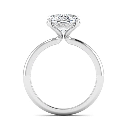 IGI certified oval cut lab grown diamond engagement ring featuring a four-prong setting with a hidden halo of round accent diamonds in white gold tone.