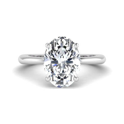 IGI certified oval cut lab grown diamond engagement ring featuring a four-prong setting with a hidden halo of round accent diamonds in white gold tone.