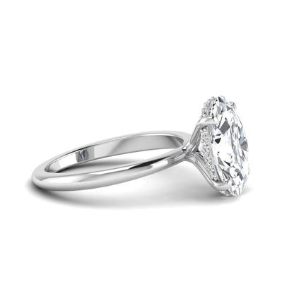 IGI certified oval cut lab grown diamond engagement ring featuring a four-prong setting with a hidden halo of round accent diamonds in white gold tone.
