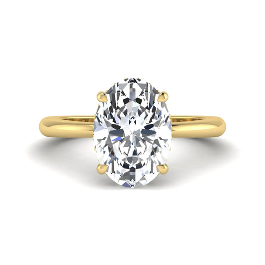 IGI certified oval cut lab grown diamond engagement ring featuring a four-prong setting with a hidden halo of round accent diamonds in yellow  gold tone.