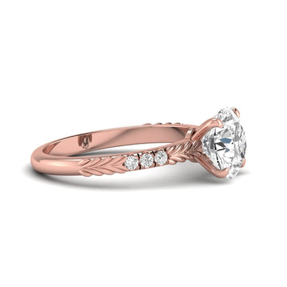 IGI certified round cut lab grown diamond engagement ring with a four-prong setting, vintage leaf-inspired band, and round accent diamonds in rose gold tone.