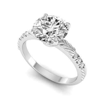 IGI certified round cut lab grown diamond engagement ring with a four-prong setting, vintage leaf-inspired band, and round accent diamonds in white gold tone.