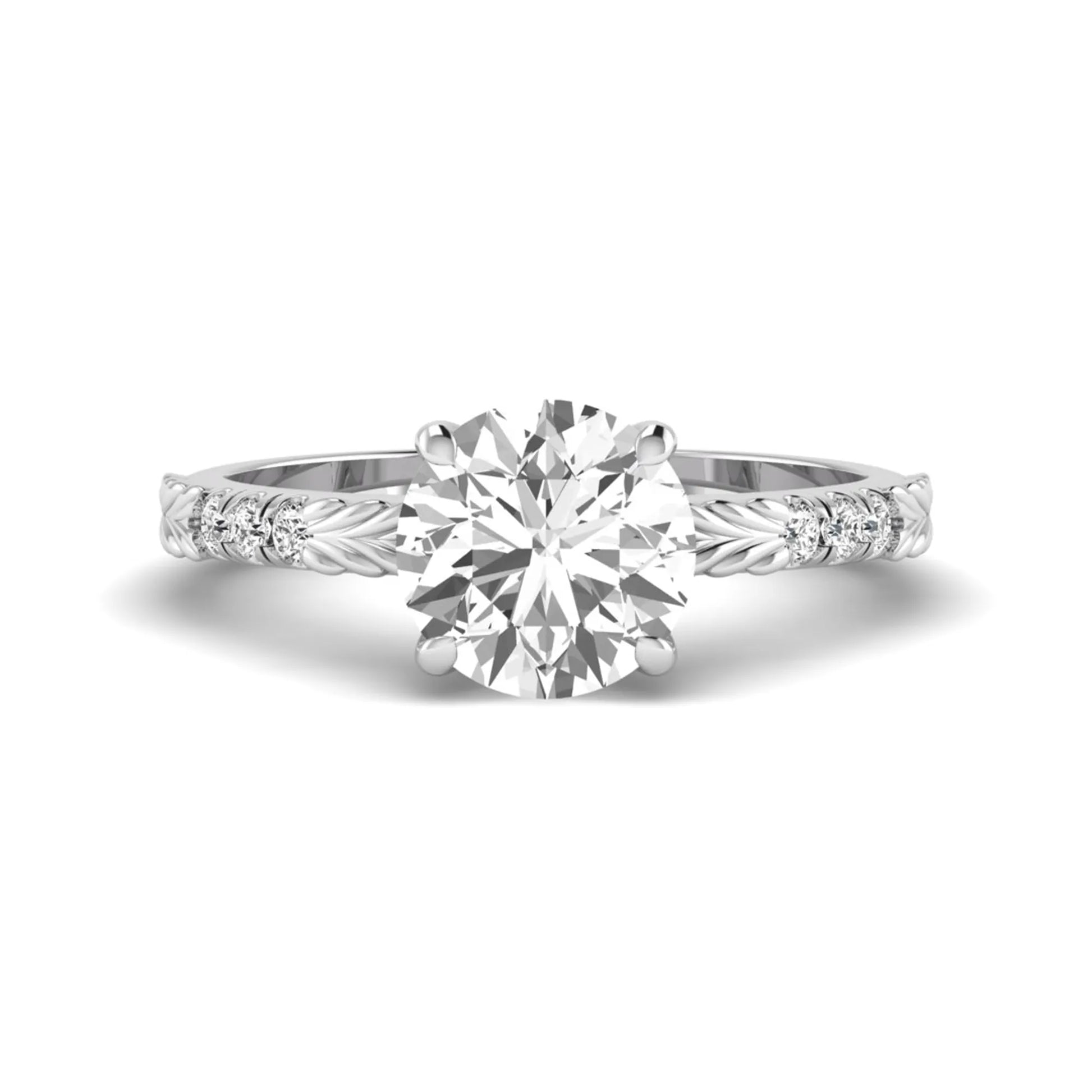 IGI certified round cut lab grown diamond engagement ring with a four-prong setting, vintage leaf-inspired band, and round accent diamonds in white gold tone.