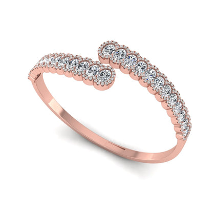 Rose-gold ring with diamonds on a white background