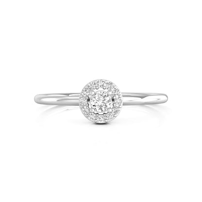 Diamond ring with a halo setting on a white background