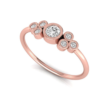 Rose-gold ring with diamond accents on a white background