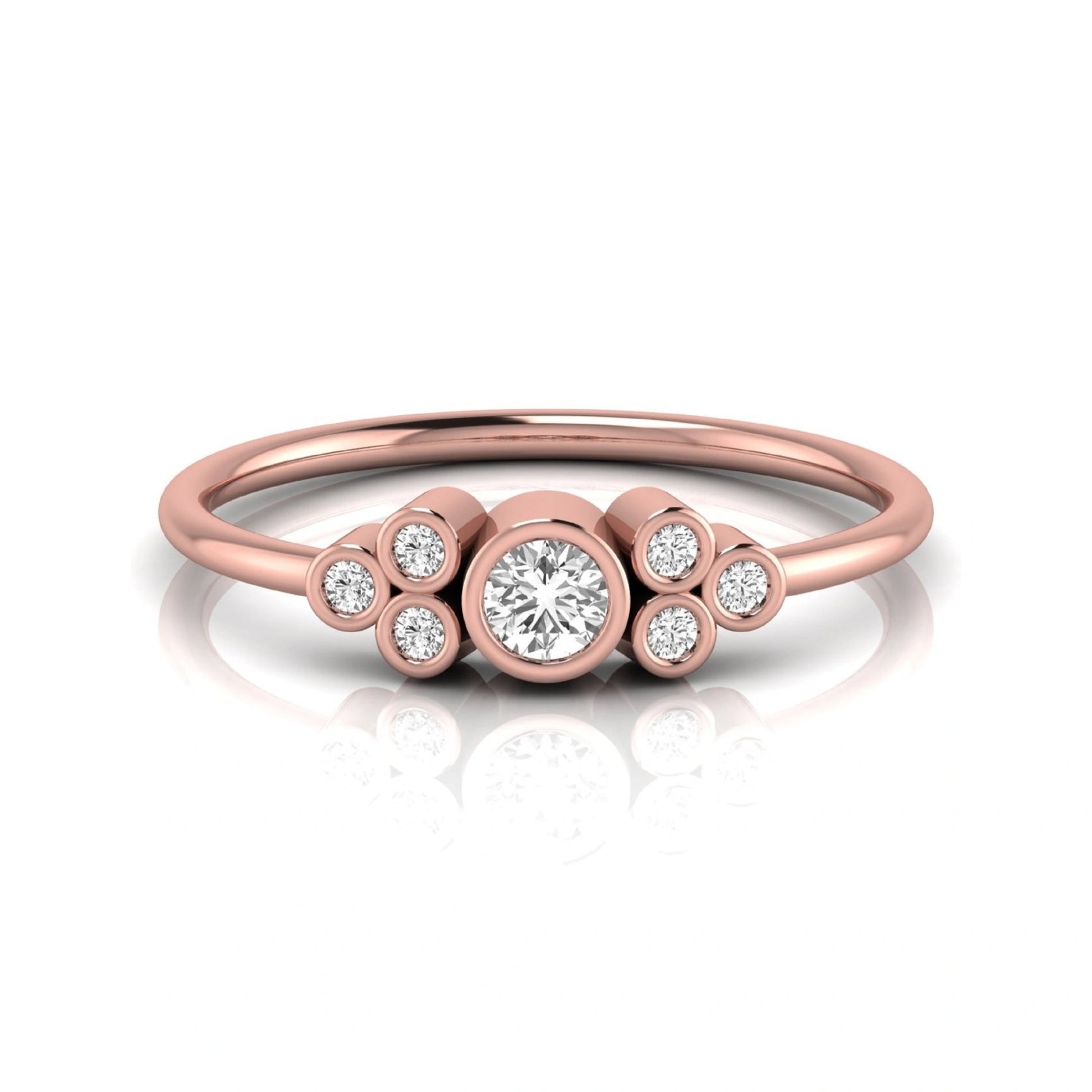 Rose-gold ring with circular diamonds on a white background