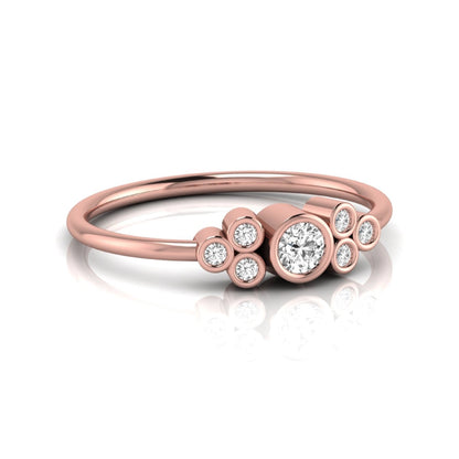 Rose-gold ring with diamond accents on a white background