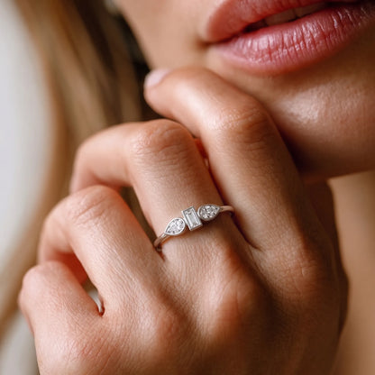 yellow-gold Close-up of a hand wearing a diamond ring with a blurred background