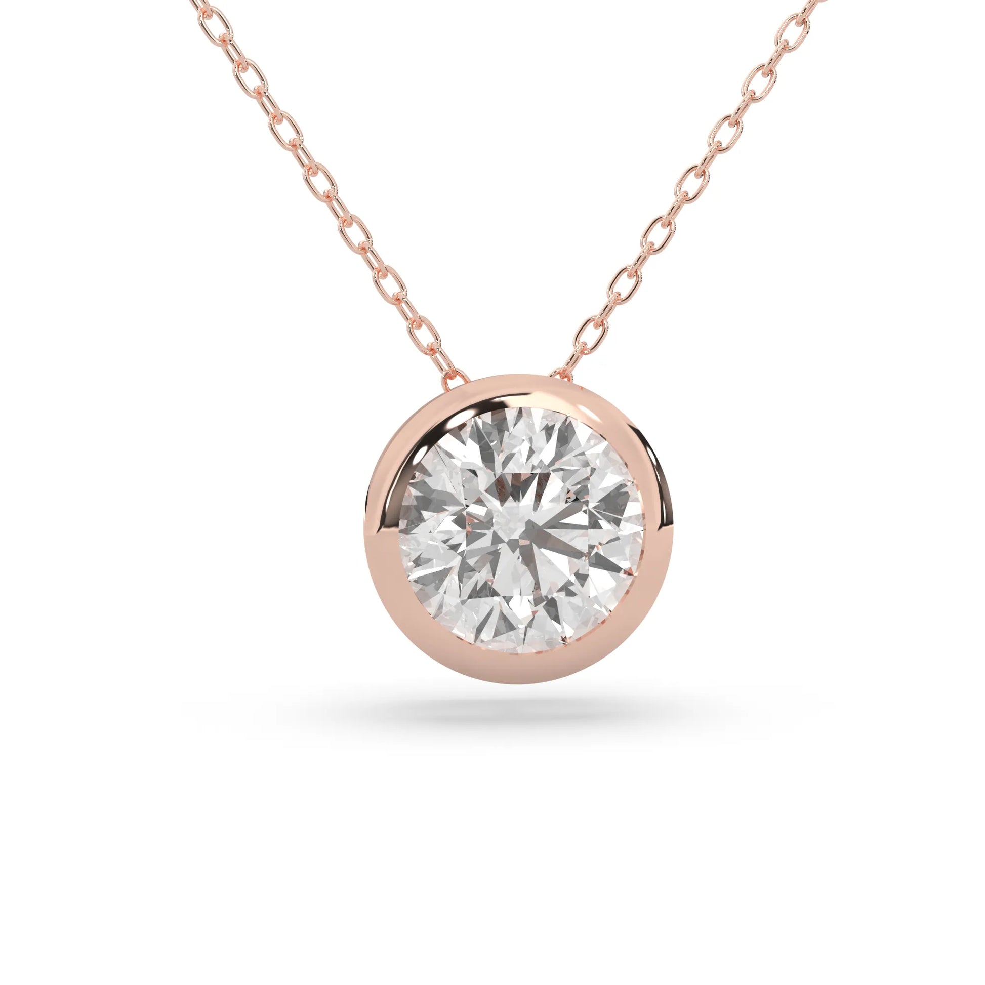 Round brilliant lab grown diamond solitaire pendant necklace in bezel setting with rose gold tone design and cable chain.