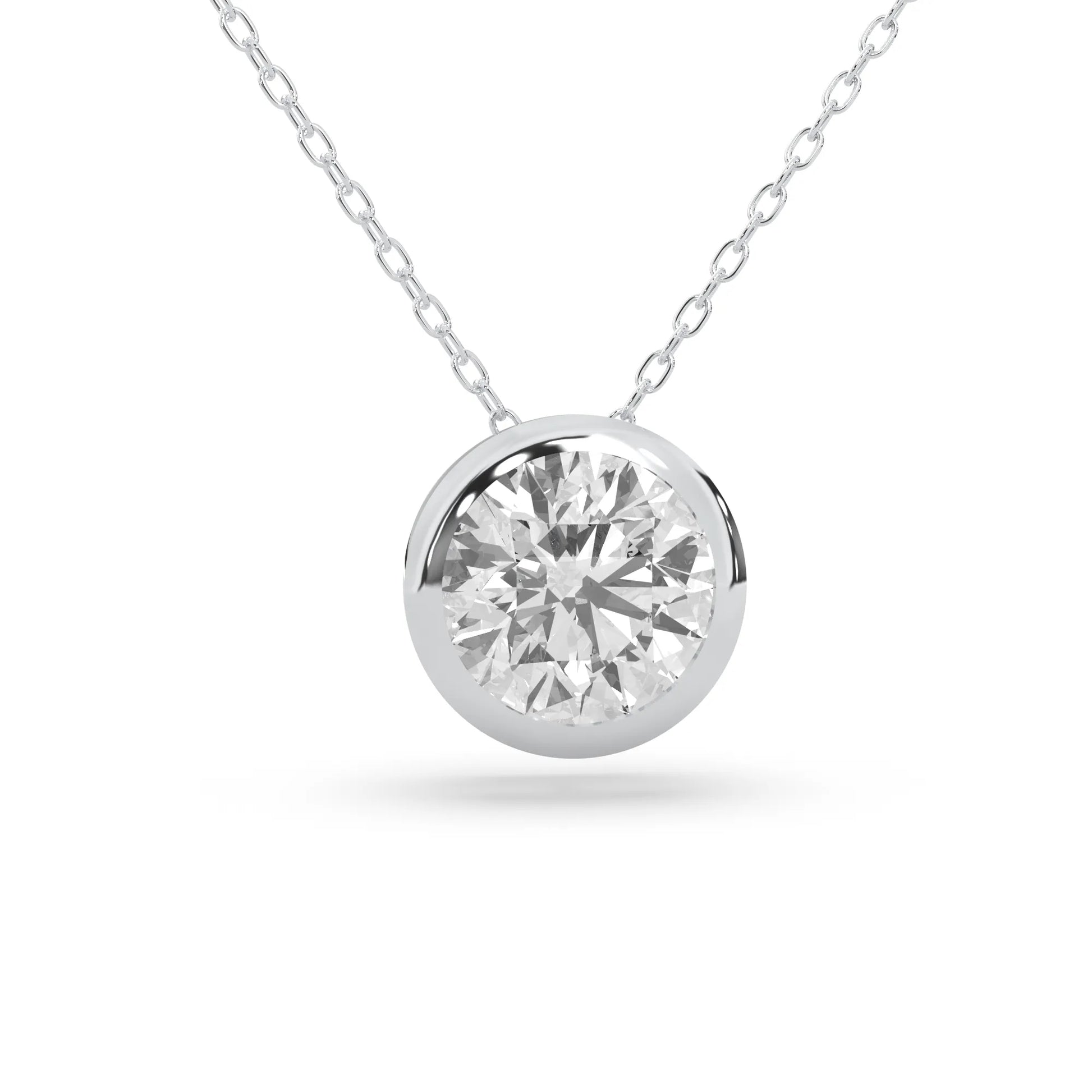 Round brilliant lab grown diamond solitaire pendant necklace in bezel setting with white gold tone design and cable chain.