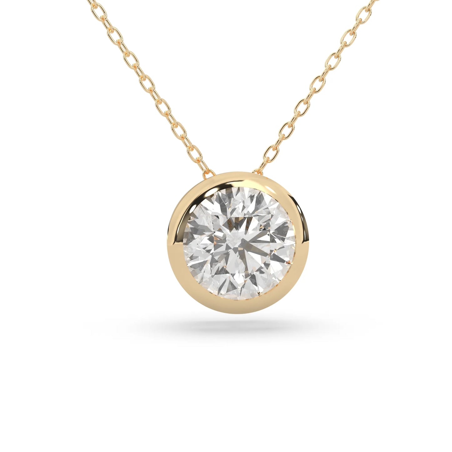 Round brilliant lab grown diamond solitaire pendant necklace in bezel setting with yellow gold tone design and cable chain.