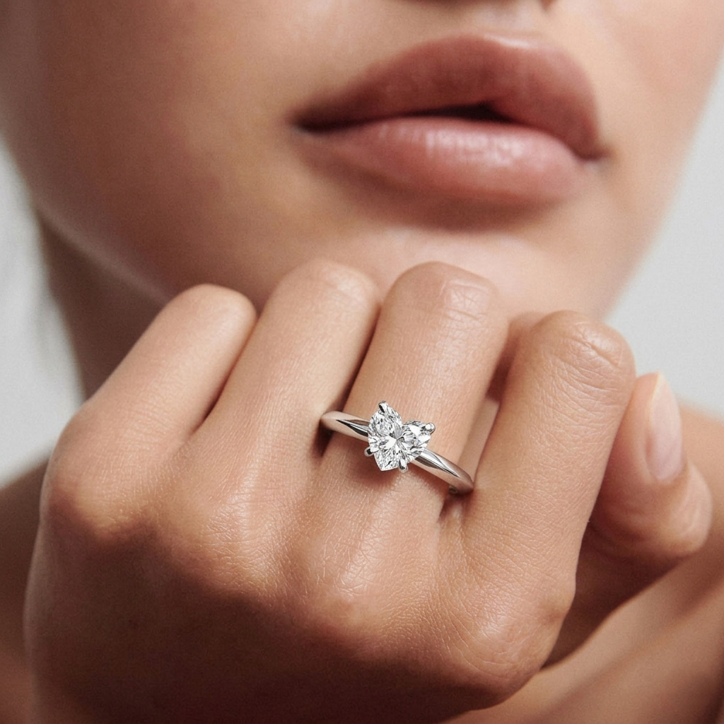 yellow gold Close-up of a diamond ring on a finger with a blurred background