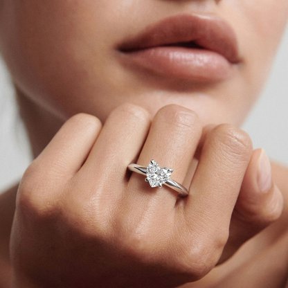 yellow gold Close-up of a diamond ring on a finger with a blurred background