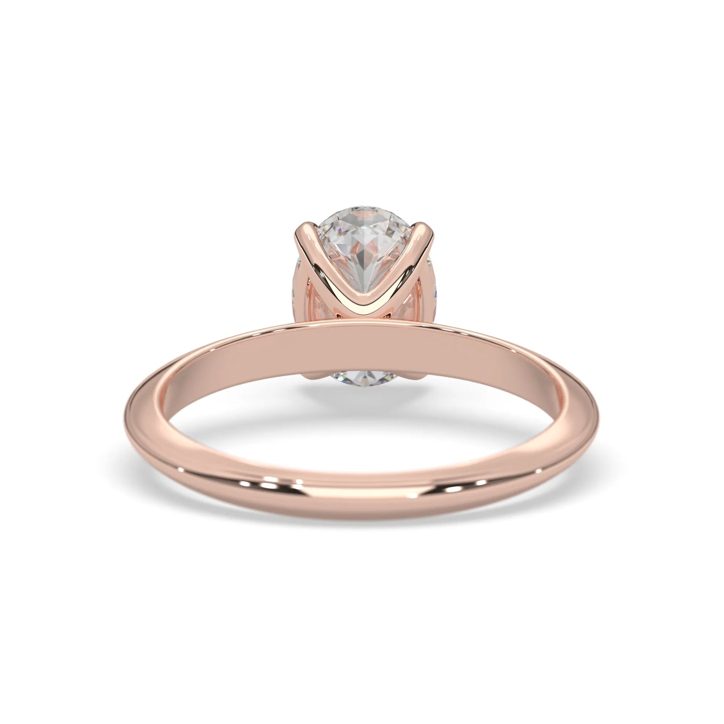 Rose-gold ring with a clear gemstone on a white background