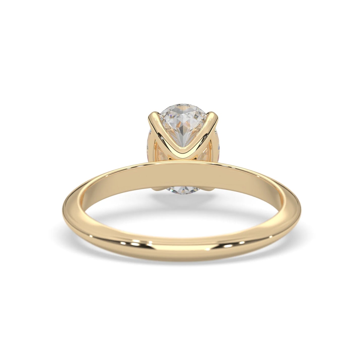yellow-Gold ring with a clear gemstone on a white background