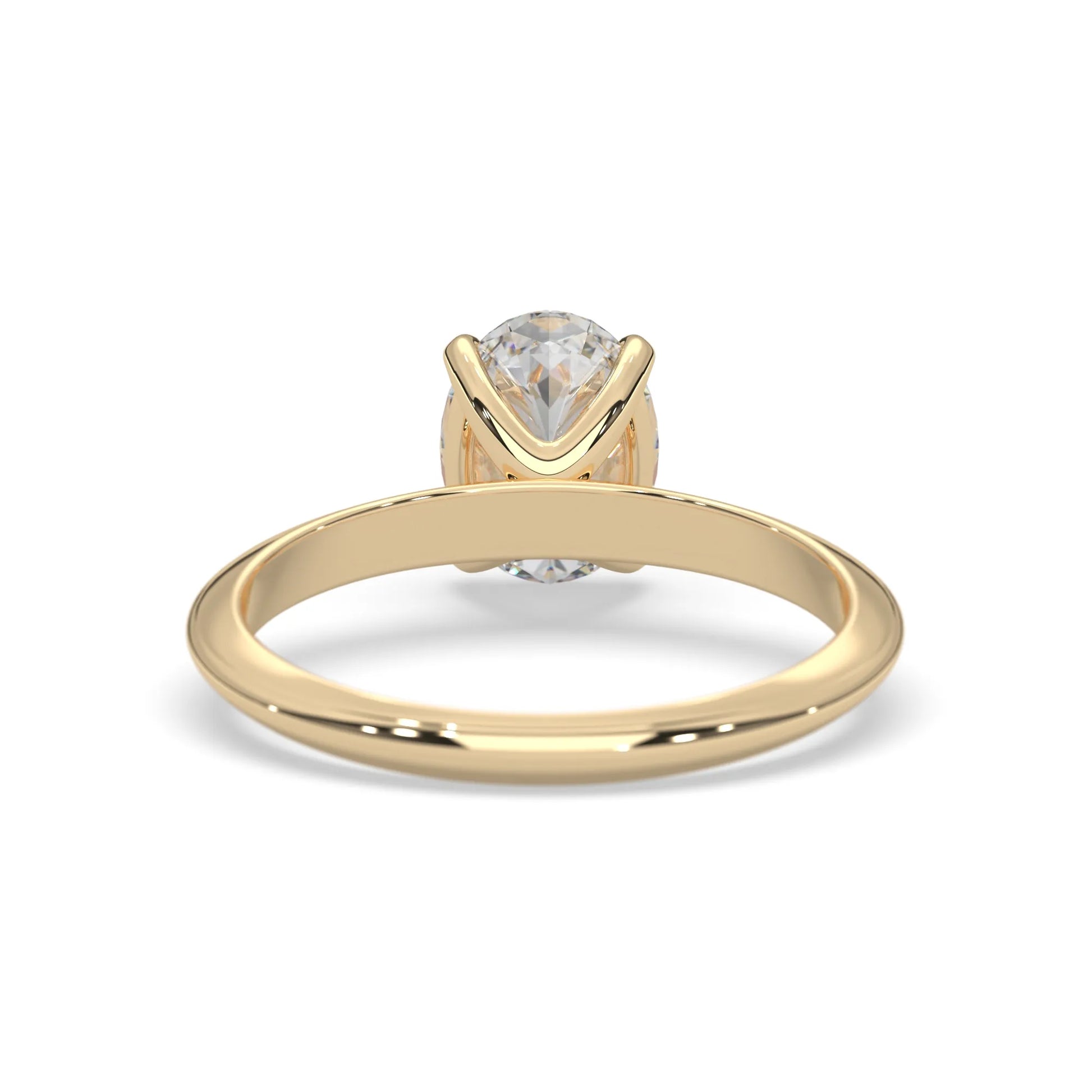 yellow-Gold ring with a clear gemstone on a white background
