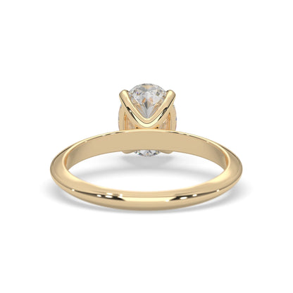 yellow-Gold ring with a clear gemstone on a white background