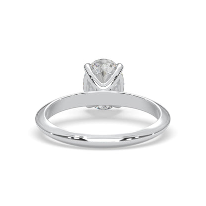 white-gold ring with a clear gemstone on a white background
